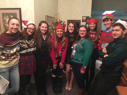 students gather for a holiday party