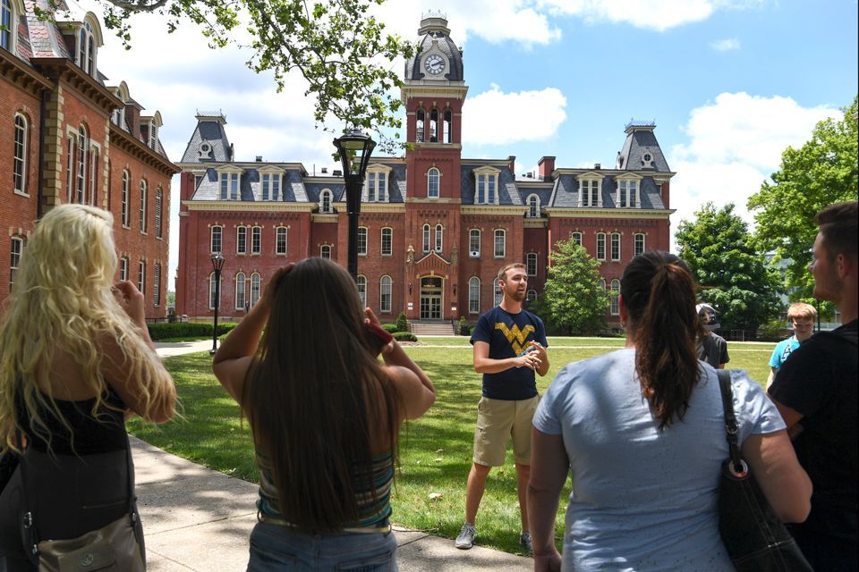 tour guide leading a tour on campus