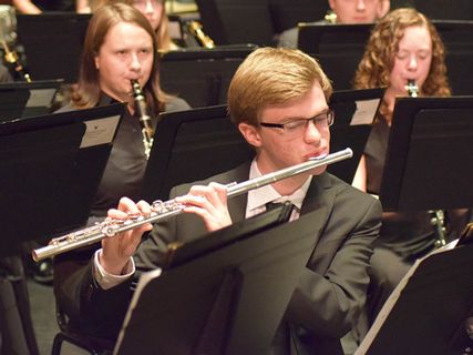 student plays the flute in symphonic band