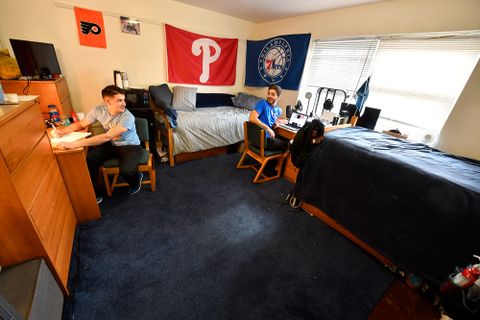 two students hanging out in their room